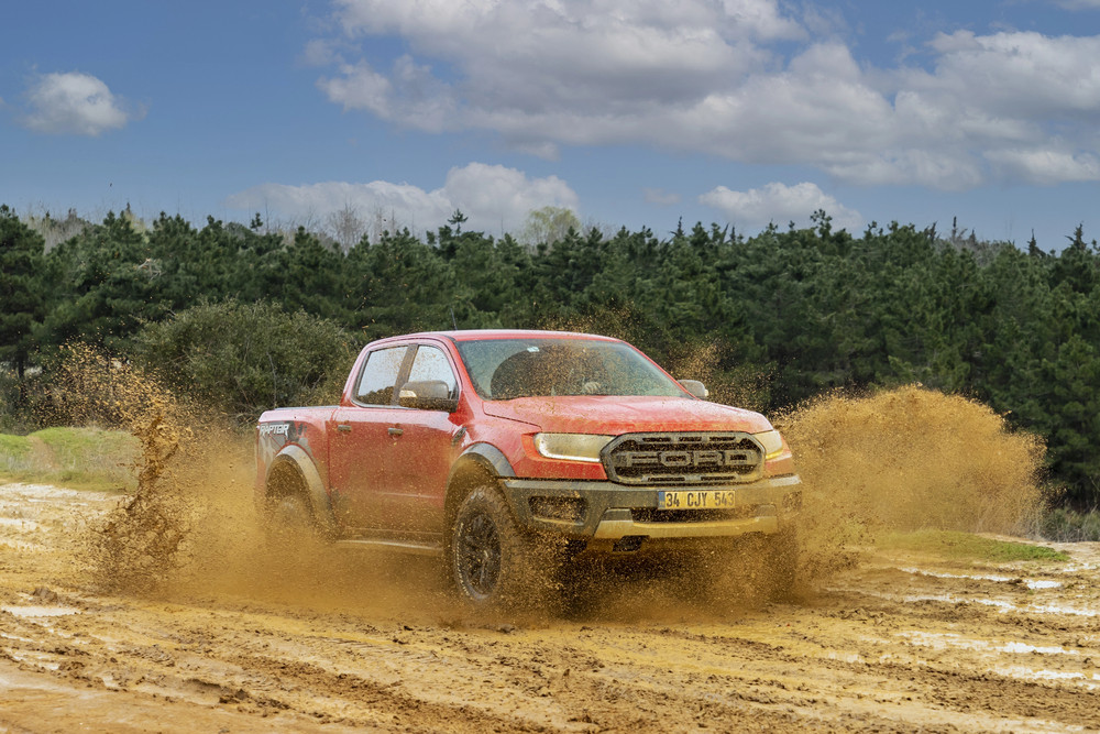 Ford Ranger Raptor with off-road styling on rugged terrain