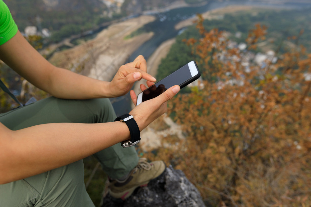 Australian traveller using an eSIM on a smartphone while travelling overseas